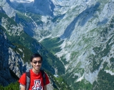 Alumnus Patt Intarakamhang, who earned a degree in mechanical engineering and was an honors student, shows his Wildcat pride atop a mountain in southern Germany. Alumnus Patt Intarakamhang, who earned a degree in mechanical engineering and was an honors student, shows his Wildcat pride atop a mountain in southern Germany.
